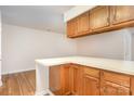 A cozy kitchen with white counter tops and wooden cabinets at 6203 Rosecroft Dr, Charlotte, NC 28215
