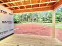 View of the backyard and the unfinished deck of this new home under construction at 1143 Journey Ln, Salisbury, NC 28146