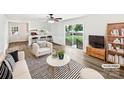 Bright living room featuring modern decor and a sliding door to the backyard at 1224 Bethlehem Rd, Kings Mountain, NC 28086