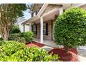 Inviting front porch with white columns and manicured landscaping, offering curb appeal at 13305 Mallard Landing Rd, Charlotte, NC 28278