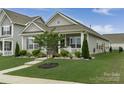 Well-maintained home with a landscaped lawn and inviting curb appeal at 148 Kerri Dawn Ln, Locust, NC 28097