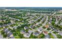 Expansive aerial view of a well-planned residential community with tree-lined streets and manicured lawns at 1522 Napa Nw St # 1240, Concord, NC 28027