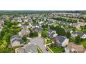 Aerial view of a residential neighborhood showcasing neatly arranged homes and lush greenery at 1522 Napa Nw St # 1240, Concord, NC 28027
