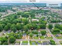 Aerial view of the home near Camp North End and Tipsy Pickle in a tree-lined neighborhood at 2017 Brewton Dr, Charlotte, NC 28206