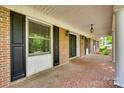 Inviting brick porch features stylish lighting, classic brickwork, and attractive curb appeal at 257 Amity Dr, York, SC 29745