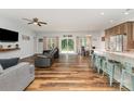 Open-concept living space with wood floors, ceiling fan, and access to the kitchen and dining area at 2705 Enon Church Rd, Salisbury, NC 28147