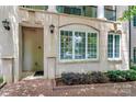 Charming condo front entrance with well-lit access, complemented by large windows at 300 W 5Th St # 003, Charlotte, NC 28202