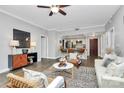 Bright living room flows into the kitchen, featuring hardwood floors and modern decor at 300 W 5Th St # 003, Charlotte, NC 28202