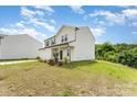 Attractive two-story home with a two-car garage and a well-manicured lawn at 3077 Light Ridge Sw Ct, Concord, NC 28027