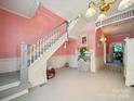 Charming foyer with a staircase and vintage details, showcasing the home's classic architectural style at 408 S Ellis St, Salisbury, NC 28144