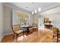 Charming entryway with hardwood floors, bright natural light, and stylish furnishings at 4460 Coventry Row Ct, Charlotte, NC 28270