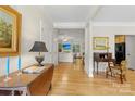 Inviting hallway showcasing gleaming hardwood floors and elegant decor at 4460 Coventry Row Ct, Charlotte, NC 28270
