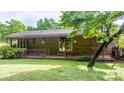 Inviting covered back porch with brick facade and a cozy outdoor space at 518 W School St, Maiden, NC 28650