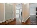 Welcoming home foyer, showing hardwood floors, neutral colors and a view to the living area at 6618 Alexander Rd, Charlotte, NC 28270