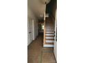 Bright foyer featuring stairs, a wooden banister, and natural light streaming in at 725 Sirius Ln # 90, York, SC 29745
