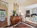 Foyer with a decorative mirror, elegant console table, and views into the adjacent rooms at 828 Colville Rd, Charlotte, NC 28207