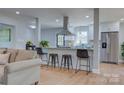 Modern kitchen with stainless steel appliances, granite countertops, a breakfast bar and a large pantry at 8607 Larchmont Cir, Charlotte, NC 28214
