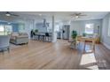 Bright, open living space with hardwood floors, neutral decor, and a seamless transition to the kitchen area at 8607 Larchmont Cir, Charlotte, NC 28214