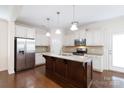 Modern kitchen with granite countertops, stainless steel appliances, and kitchen island at 1148 Bannockburn Ave, Rock Hill, SC 29732