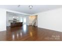 Open-concept living space with hardwood floors and an eat-in kitchen at 1148 Bannockburn Ave, Rock Hill, SC 29732