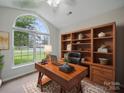 Stylish office space with a large window, built-in shelving, and a comfortable desk for a productive work environment at 1148 Stallings Rd, Matthews, NC 28104