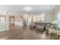 Comfortable living area featuring an expansive couch and modern flooring at 1219 Century Dr, Clover, SC 29710