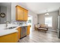 Bright eat-in kitchen featuring stainless steel appliances, light wood cabinetry, and a cozy dining nook at 129 Sara Ln, Statesville, NC 28625