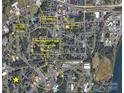 An aerial map displays the neighborhood and nearby amenities, aiding in location assessment at 205 Woods St, Mount Holly, NC 28120
