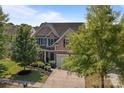 Well-maintained home with mature trees, a spacious driveway, and attractive curb appeal at 2233 Sonoma Valley Dr, Charlotte, NC 28214