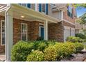 Inviting front porch with stone accents and lush landscaping for a welcoming entrance at 2233 Sonoma Valley Dr, Charlotte, NC 28214