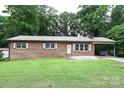 Well-maintained single story brick house with nice yard and a convenient covered carport at 2625 Glenn St, Newton, NC 28658