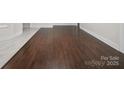 Attractive wood flooring complements the tile accent in this updated home at 322 Peachtree St, Albemarle, NC 28001