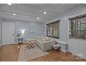 Cozy living room with hardwood floors, a decorative ceiling, and neutral tones at 4043 Windward Dr, Fort Mill, SC 29708