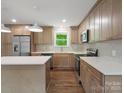 Bright kitchen featuring stainless steel appliances, stylish cabinets, and an island at 4126 Howie Cir, Charlotte, NC 28205