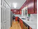 Kitchen with bright red cabinets and stainless steel appliances at 460 27Th Avenue Nw Cir, Hickory, NC 28601