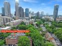 A stunning aerial view of the city skyline from the building's vantage point at 515 N Church St # 305, Charlotte, NC 28202