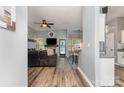 Open-concept living room featuring stylish floors, a fireplace with TV, and a seamless transition to the kitchen at 5829 Andrew Ward Ave, Charlotte, NC 28216