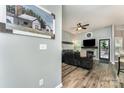 Cozy living room showcases wood floors, a fireplace with a TV, and a comfortable leather couch at 5829 Andrew Ward Ave, Charlotte, NC 28216