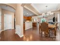Inviting dining area with hardwood floors, stylish lighting, and seamless flow to the kitchen and living spaces at 7130 Maricopa Rd, Charlotte, NC 28277