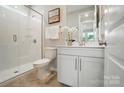 Modern bathroom featuring a glass shower, vanity, and neutral color scheme at 9930 Cask Way, Huntersville, NC 28078