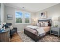 Cozy bedroom with large windows, a comfortable bed, and stylish decor at 9930 Cask Way, Huntersville, NC 28078