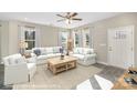 Spacious living room with a ceiling fan, modern decor, neutral paint and lots of natural light at 1102 Grady St, Salisbury, NC 28144