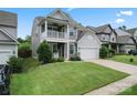 Charming two-story home with a welcoming front porch and attached two-car garage at 1306 San Gabriel Ave, Charlotte, NC 28214