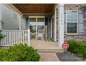 Inviting front porch with rocking chairs, stone accents, and a 'Welcome' sign at 1306 San Gabriel Ave, Charlotte, NC 28214