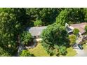 Aerial view of home surrounded by lush trees, offering privacy and tranquility at 155 Springdale Acres Dr, Mooresville, NC 28115