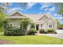 Charming home featuring a brick walkway, meticulously landscaped front yard, and neutral exterior at 187 Spring Run Dr, Mooresville, NC 28117