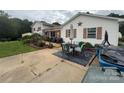Outdoor patio with furniture, perfect for entertaining and relaxing, surrounded by green grass at 1895 Sandy Cir, Newton, NC 28658