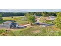 New construction home on a large lot featuring well-maintained landscaping and a concrete driveway at 21013 Running Creek Dr # 4, Locust, NC 28097
