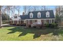 Well-maintained brick home with manicured lawn and inviting front entrance with painted white railings at 3500 Sunningdale Ln # 221, Statesville, NC 28625