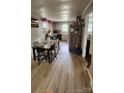 Eat-in kitchen featuring durable laminate flooring, functional appliances, and plenty of counter space at 3715 Patricia Nw Dr, Concord, NC 28027